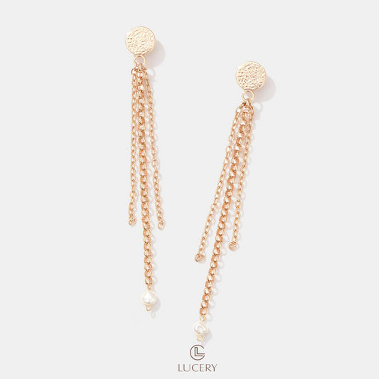 Indulge in the elegance of our Glittering Cascade Chain Earrings, featuring a textured gold disc leading to a delicate chain that ends with a solitary pearl, embodying refined sophistication.