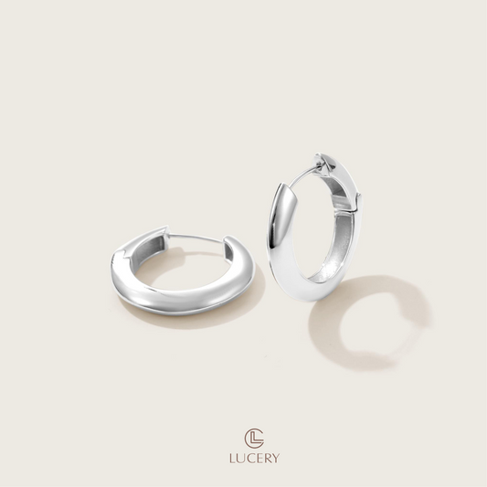 These Chic Crescent Hoop Earrings, with their bold curve and open design, are a modern twist on the classic hoop. Perfect for adding an artistic touch to any outfit, they capture the light and the attention of any room.