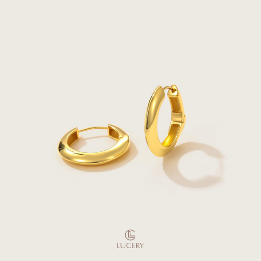 These Chic Crescent Hoop Earrings, with their bold curve and open design, are a modern twist on the classic hoop. Perfect for adding an artistic touch to any outfit, they capture the light and the attention of any room.