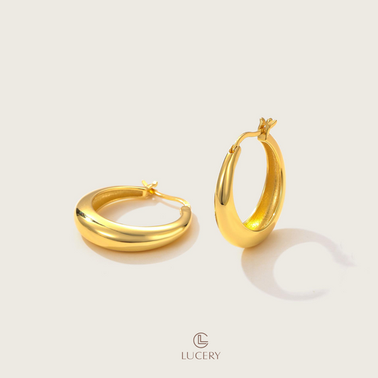 These Bold Curve Hoop Earrings stand out with their voluptuous shape and lustrous finish. Ideal for making a chic statement, they're a contemporary classic