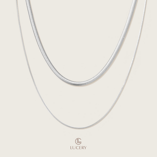 This necklace offers a dual strand of 18K gold-plated S925 silver, each layer presenting a sleek, polished finish. The gentle curves mimic a serene horizon, perfect for a sophisticated and minimalist aesthetic.