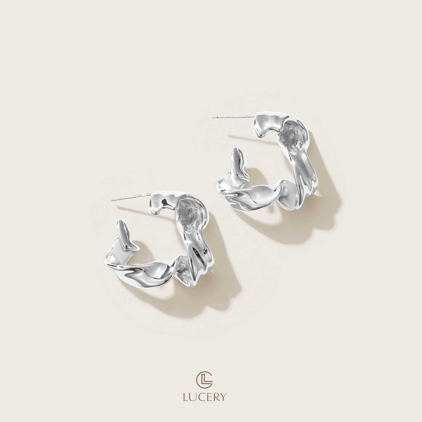 Ignite your style with these Sculpted Flame Hoop Earrings, featuring a bold twist that mimics the dynamic shape of flames. They offer a statement piece that's both fiery and fashionable, perfect for elevating a chic, edgy look.