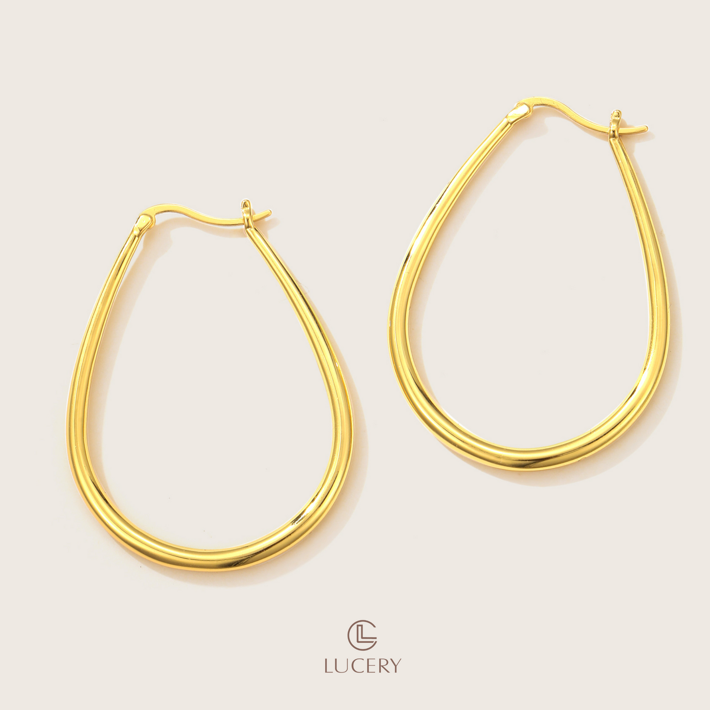 These Classic Oval Hoop Earrings feature a timeless design with a sleek, contemporary edge. The smooth contours and open design provide a versatile and flattering look suitable for any occasion.