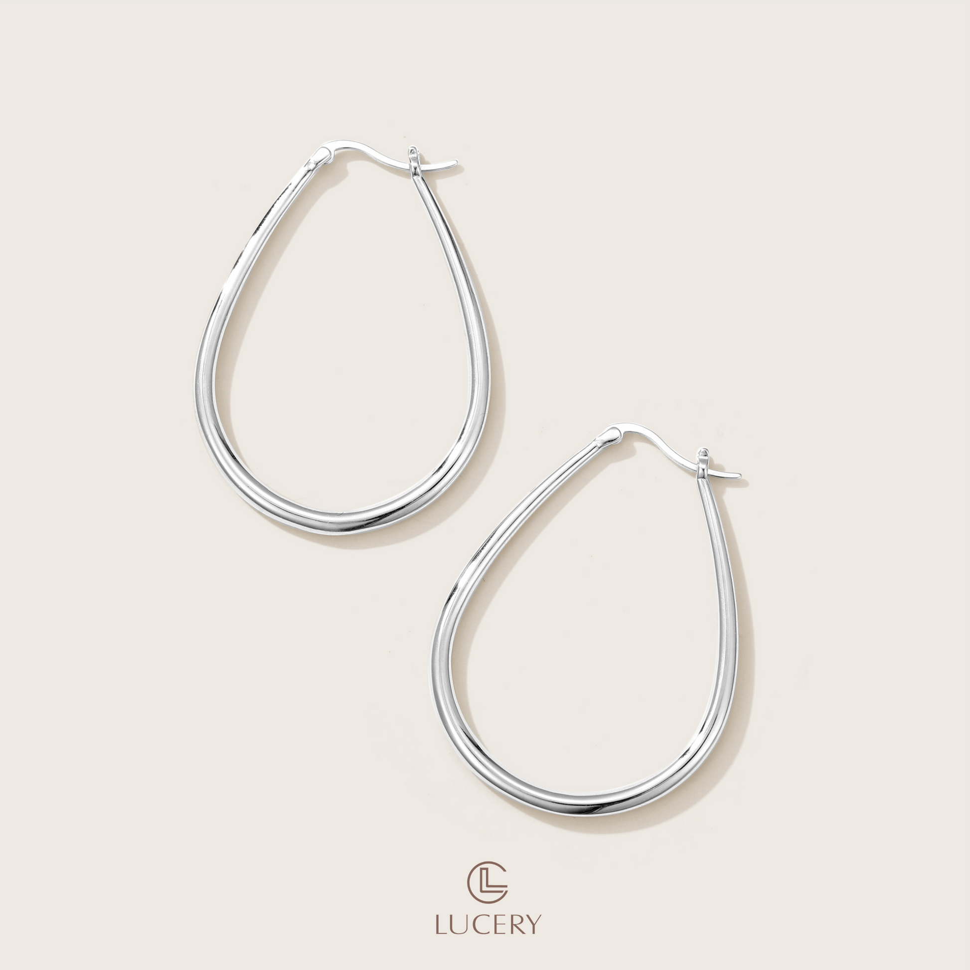 These Classic Oval Hoop Earrings feature a timeless design with a sleek, contemporary edge. The smooth contours and open design provide a versatile and flattering look suitable for any occasion.