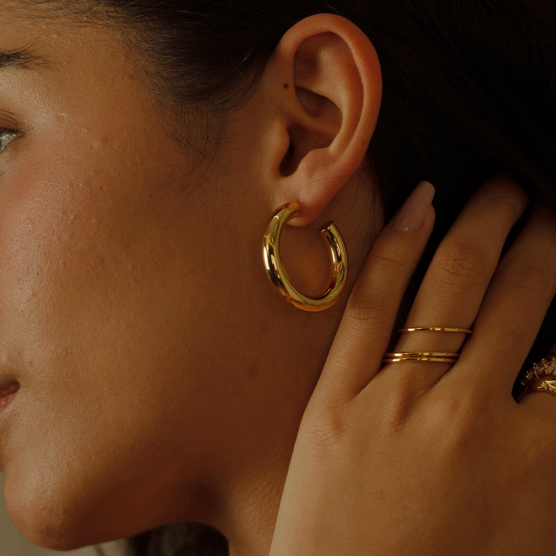 The Minimalist Open Hoop Earrings capture the essence of contemporary elegance with a simple yet striking design. Their subtle opening adds a unique twist, making them a chic addition to any modern jewelry collection.