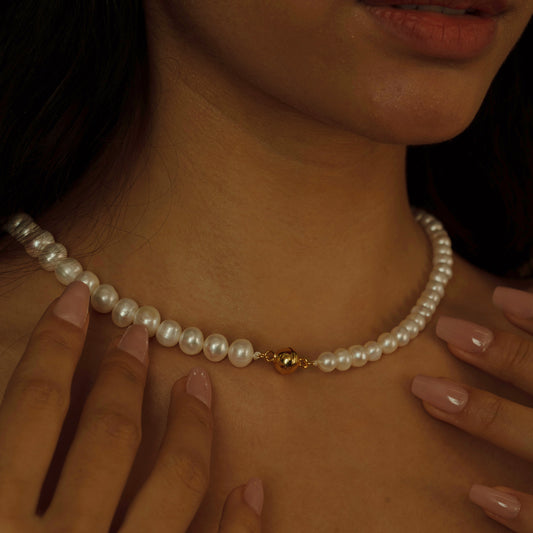 Drape yourself in the Timeless Elegance Pearl Necklace, where each lustrous pearl is handpicked to create a sequence of radiant beauty, adding a classic touch to any ensemble.