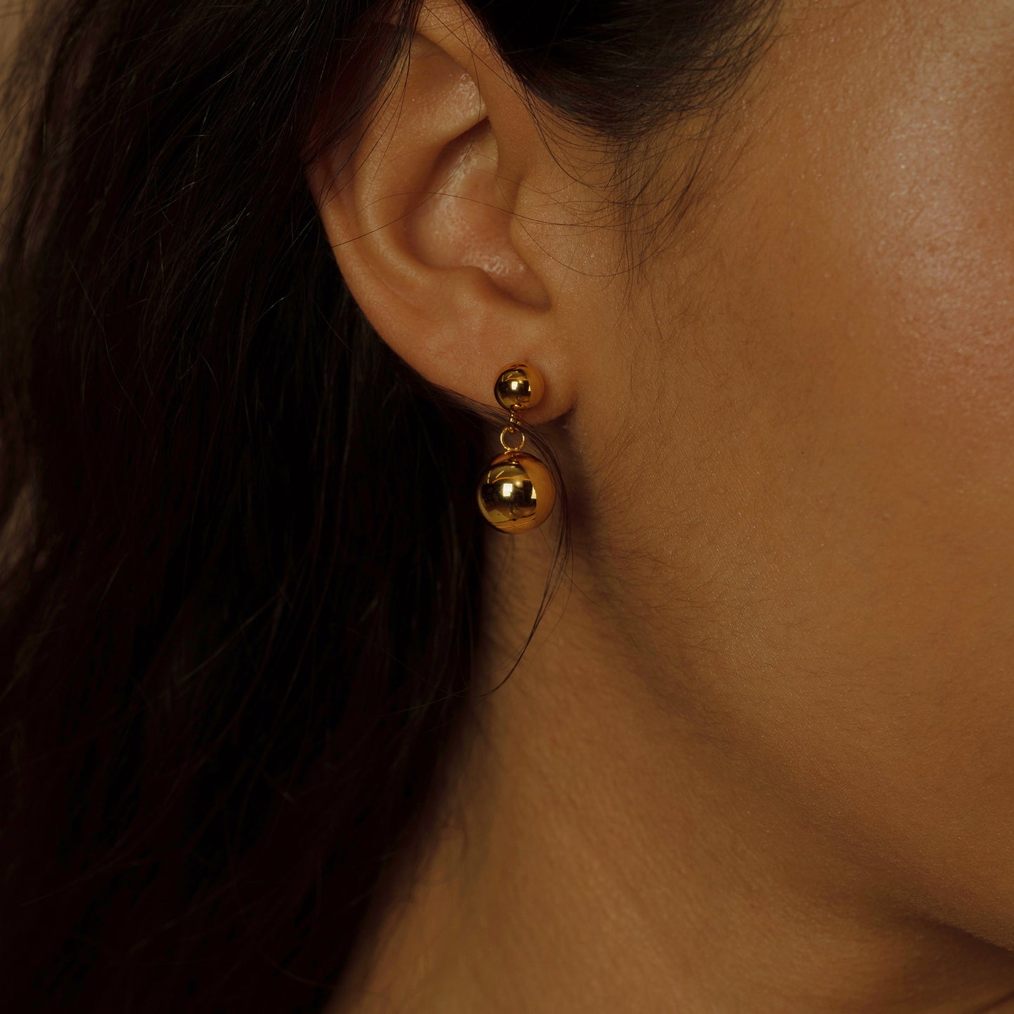 Make a bold statement with our Modernist Golden Hoop Earrings, featuring a sleek design that brings a contemporary twist to the classic hoop, perfect for a touch of modern sophistication.