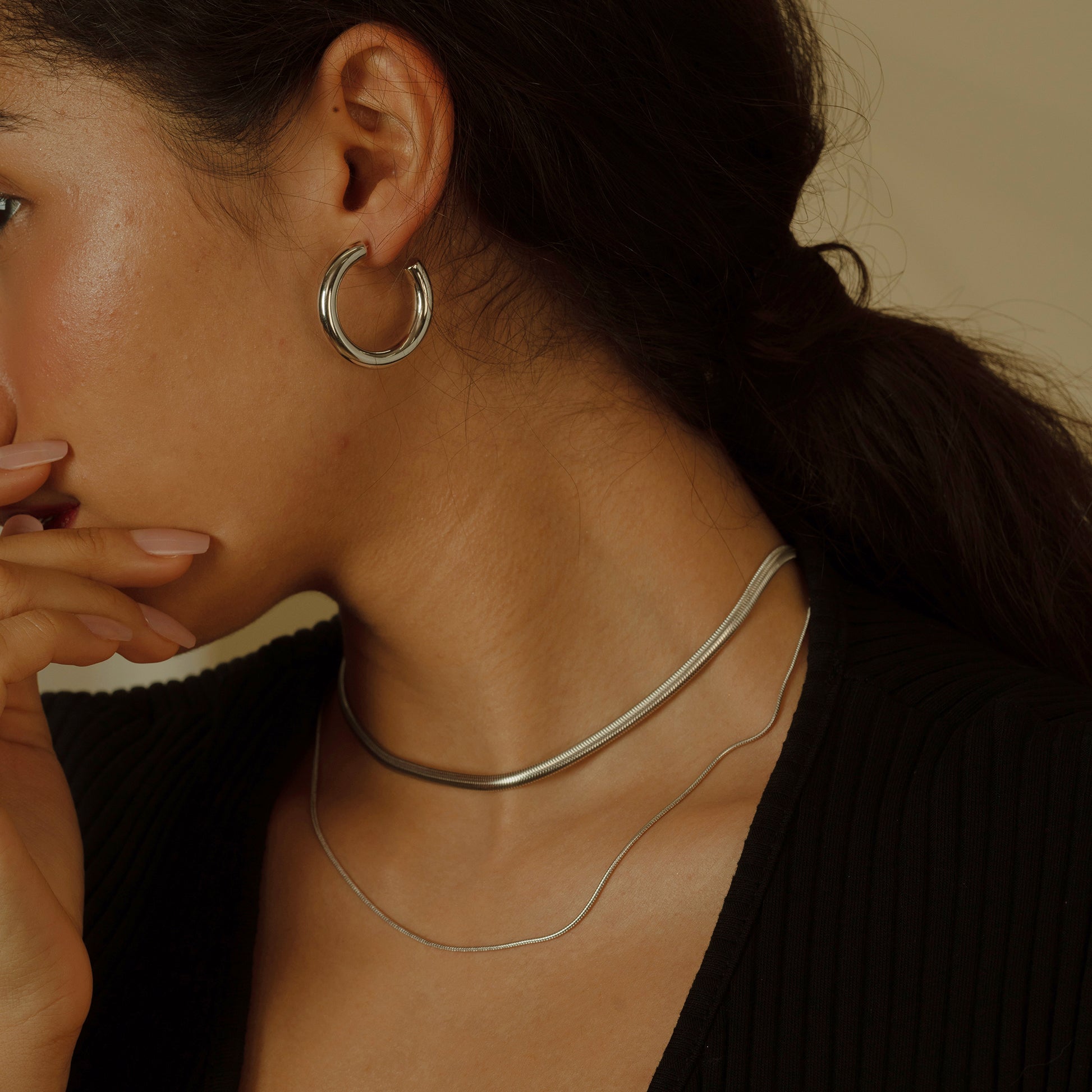 The Minimalist Open Hoop Earrings capture the essence of contemporary elegance with a simple yet striking design. Their subtle opening adds a unique twist, making them a chic addition to any modern jewelry collection.