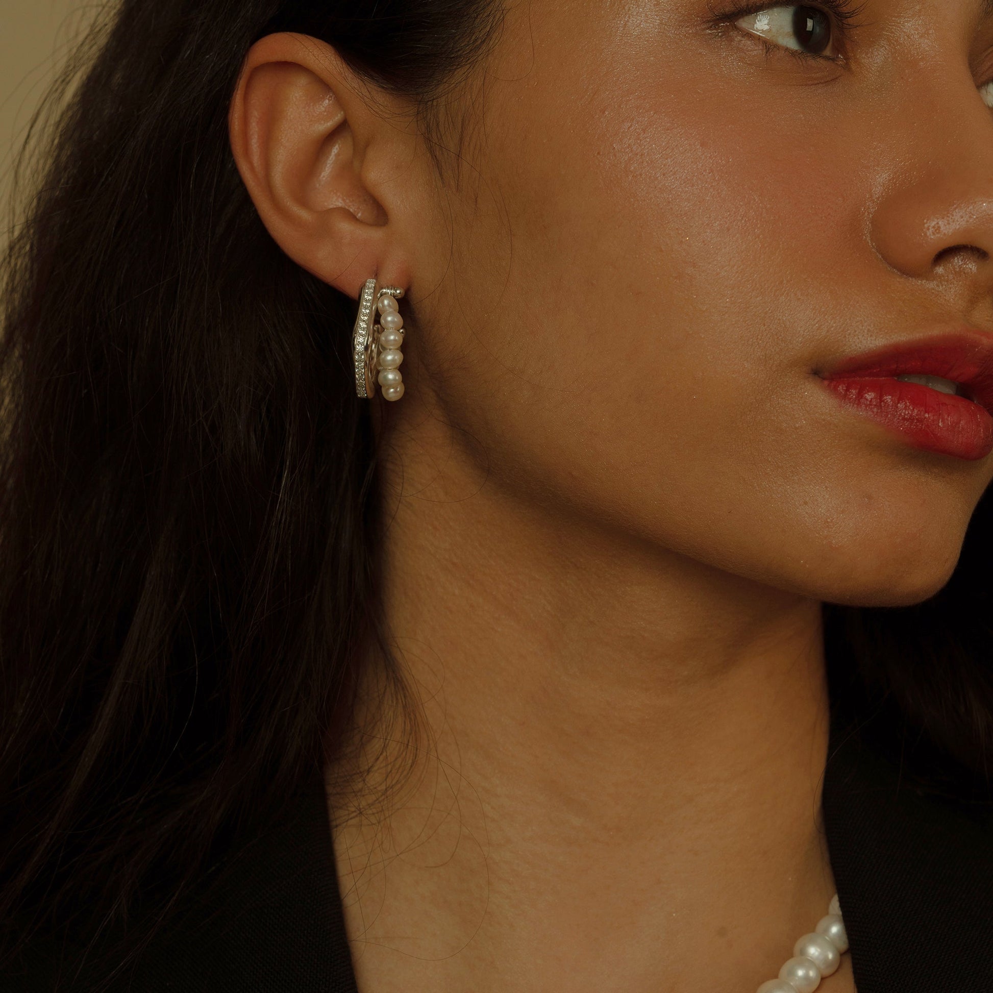 A symphony of shine, these Luminous Pearl and Zirconia Hoop Earrings feature a radiant circle of high-luster natural freshwater pearls paired with a ring of brilliant white zirconia.